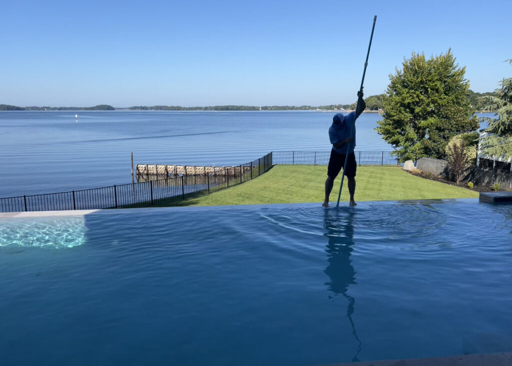 Crystal clear swimming pool maintained by Freedom Pool Service Concord NC