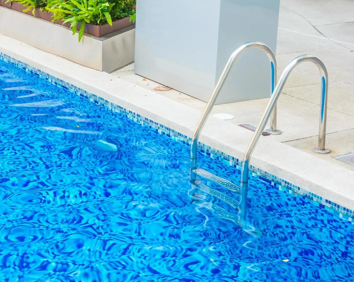 Luxury home swimming pool serviced by Freedom Pool Service in Concord NC