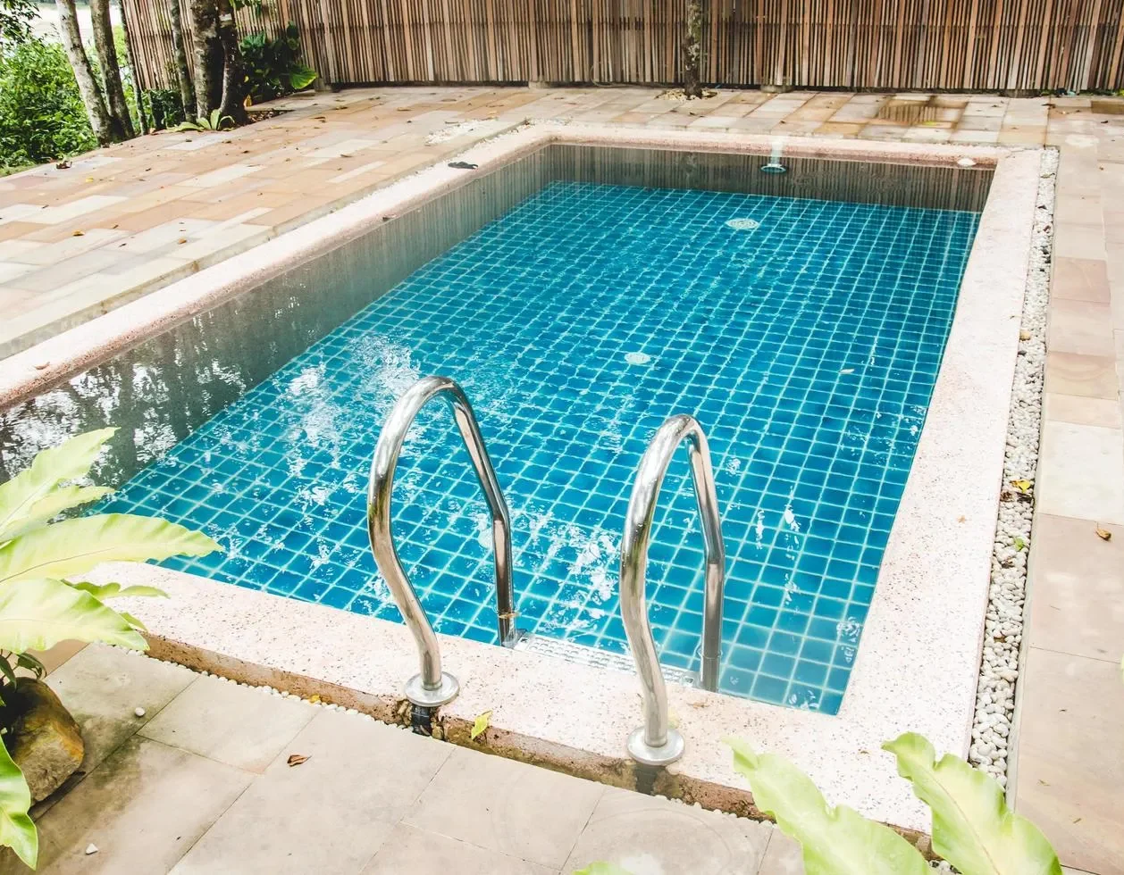 Outdoor swimming pool cleaning by Freedom Pool Service in Concord NC